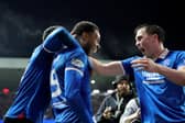 Rangers' Youssef Chermiti (centre) celebrates with John Souttar (right) after scoring the side's fourth goal and his third during the William Hill Premiership match at Ibrox Stadium against Hearts. (Photo by Steve Welsh/PA Wire)
