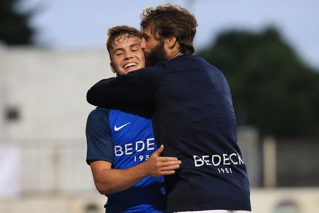 Perhaps their most famous European evening, Hamilton celebrates with goalscorer Josh Daniels after the Lurgan Blues defeated Ole Gunnar Solskjaer's Molde side 2-1 at Mourneview Park in July 2018