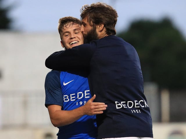 Perhaps their most famous European evening, Hamilton celebrates with goalscorer Josh Daniels after the Lurgan Blues defeated Ole Gunnar Solskjaer's Molde side 2-1 at Mourneview Park in July 2018