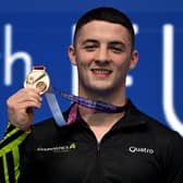 Rhys McClenaghan poses on the podium of the men's pommel horse at the 2023 Artistic Gymnastics European Championships