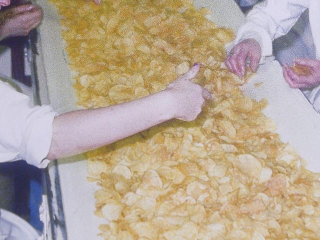 Workers sorting out the crisps on the production line at Tayto