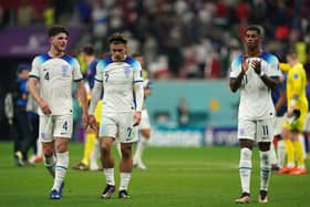 Left to right, England's Declan Rice, Jack Grealish and Marcus Rashford appear dejected after the FIFA World Cup Group B match at the Al Bayt Stadium in Al Khor, Qatar.