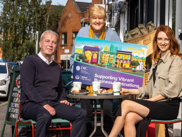 Hugh Killough, Department for Communities, Doreen McKenzie from Ballyhackamore Traders Association and chair of Belfast City Council’s City Growth and Regeneration Committee, councillor Clíodhna Nic Bhranair are pictured together outside the Guillemot Deli and Café, Ballyhackamore. Ballyhackamore Traders Association has become the first group to receive funding through the Supporting Vibrant Business Destinations initiative, led by Belfast City Council and funded through the Department for Communities Revitalisation programme. They’ll be creating a covered event space to host markets and events, refreshing and relaunching a food tour for the area and raising awareness of the Ballyhackamore experience through a dedicated marketing campaign, including the development of a range of sustainable promotional goods