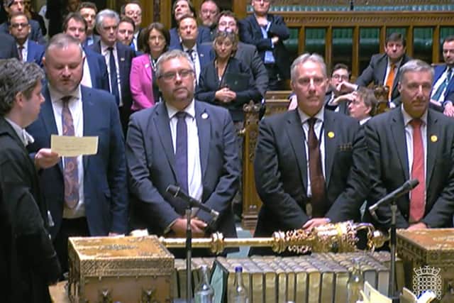 A video grab from footage broadcast by the UK Parliament's Parliamentary Recording Unit (PRU) shows tellers in the House of Commons in London on March 22, 2023, giving the result of a vote on the Northern Ireland Windsor Framework. Photo by PRU/AFP via Getty Images