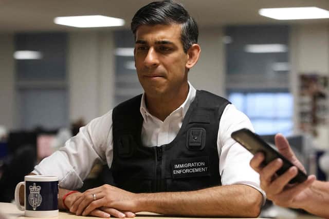 Britain's Prime Minister Rishi Sunak visits an immigration office in northwest London on June 15, 2023. (Photo by SUSANNAH IRELAND / POOL / AFP) (Photo by SUSANNAH IRELAND/POOL/AFP via Getty Images)