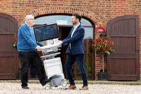 Sam McMaster, director of Telehealth and Graham Stewart, commercial & finance director at HSL photographed with a Ergotron Styleview powered cart as they move into their new Draycott headquarters