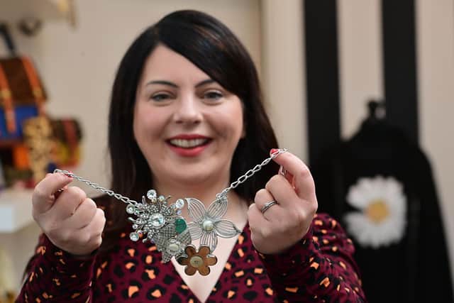 Melanie Bond owner of Melanie Bond Boutique in Dromore with one of her bespoke necklaces