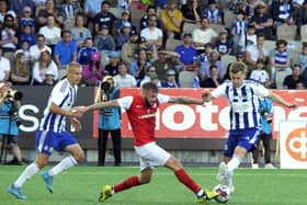Larne’s Andy Ryan gets away from HJK Helsinki’s Topi Keskinen  and Lucas Lingmann during the Champions League first qualifying round first-leg game at the Bolt Arena in Finland. (Photo by Dean Houston/Pacemaker Press)