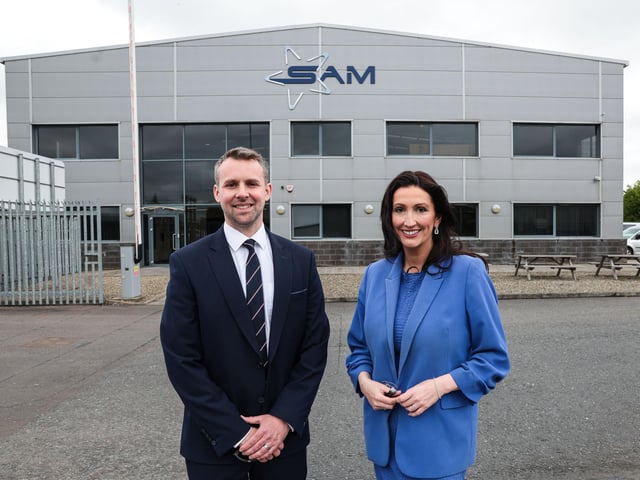 Joel Best, operations director at SAM NI with Emma Little- Pengelly dFM outside their new £10m facility