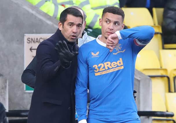 Rangers manager Giovanni van Bronckhorst gives instructions to James Tavernier. (Photo by Ian MacNicol/Getty Images)