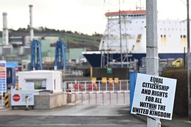 Minister Edwin Poots directed that checks on goods coming into Larne from GB should be halted.