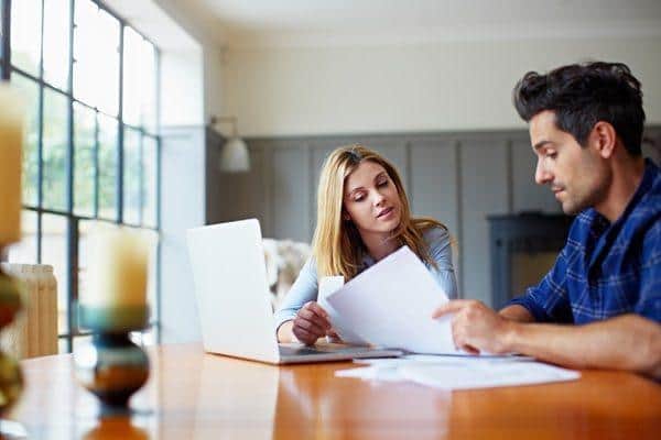 Cohabiting couple discussing making a will