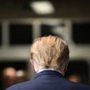 Former US President Donald Trump walks to the courtroom after speaking to the press at Manhattan Criminal Court in New York City yesterday