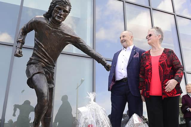 George Best statue unveiled in Belfast in 2019, near Windsor Park. Pictured are football fan Robert Kennedy, and George's sister Barbara McNarry. While it was another sister who has reported the most recent trolling, Barbara also spoke about such last year. Picture By: Arthur Allison/Pacemaker Press