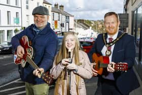 BuskFest compere Ralph McLean, one promising young performer and Lord Mayor of Armagh City, Banbridge and Craigavon Borough Council, Paul Greenfield. Register to take part of April 17 for the popular event to be held in the town on Saturday June 24