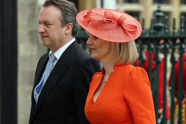 Liz Truss opted for a tangerine coloured hat