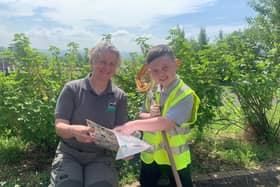 Eight-year-old Kohen Fitzsimmons, who found the first recorded location of a water stick insect in Northern Ireland in Bog Meadows Nature Reserve while pond-dipping with his Holy Trinity Primary School classmates. Issue date: Friday May 17, 2024. PA Photo