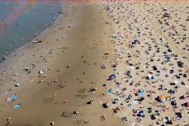 A view of a busy beach in Margate, Kent in hot weather on Sunday. Pic Gareth Fuller/PA Wire