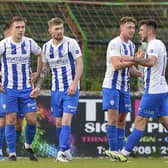 Jamie McGonigle is mobbed by his Coleraine team-mates after opening the scoring at The Oval