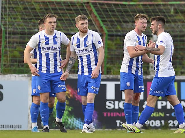 Jamie McGonigle is mobbed by his Coleraine team-mates after opening the scoring at The Oval