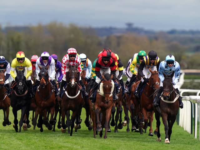 Runners and riders during the opening race, the William Hill Handicap Hurdle, on day three of the 2024 Randox Grand National Festival at Aintree Racecourse, Liverpool. (Photo by Bradley Collyer/PA Wire).