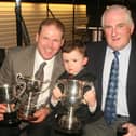 Pictured in April 20908 is Des Wright (right), who is seen presenting cups to Andrew and Thomas Nevin during the Garvagh Ploughing Society match awards dinner in the Imperial Hotel, Garvagh. Picture: Farming Life archives/Kevin McAuley