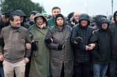 Protestors (including Deirdre Hargey, centre, next to principal deputy speaker of the Assembly Caral Ni Chuilin) blocking the road on Sunday morning ahead of the planned Orange Order (Stephen Davison/Pacemaker Press)