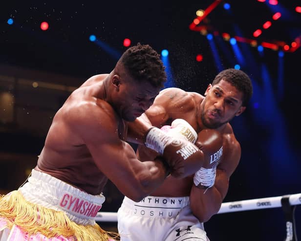 Anthony Joshua punches Francis Ngannou during the heavyweight fight on the Knockout Chaos boxing card at the Kingdom Arena in Riyadh, Saudi Arabia. (Photo by Richard Pelham/Getty Images)