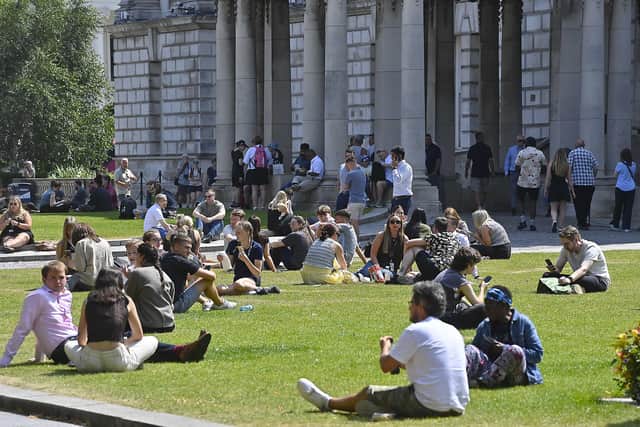 Crowds gather at lunch time at Belfast City Hall Gardens to enjoy the fine weather on Thursday 16 July 2026. Picture By: Arthur Allison/Pacemaker Press.