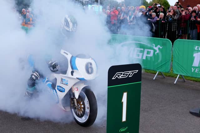 Michael Dunlop celebrates winning the Classic Superbike race at the centenary Manx Grand Prix in August