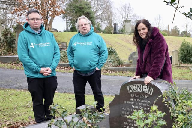 Janice Stockman and her husband, Steve, are joined by Father Martin Magill (centre) at the grave of Janice’s grandmother in Belfast City Cemetery. Photo: Stephen Davison.