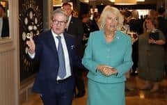 James McGinn showing Queen Camilla round the Grand Central, during the hotel's official opening