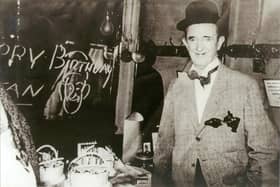 Stan Laurel celebrating his 62nd birthday backstage at the Grand Opera House in 1952