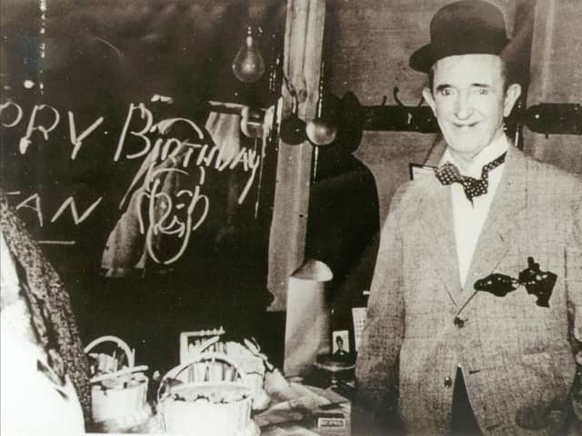Stan Laurel celebrating his 62nd birthday backstage at the Grand Opera House in 1952