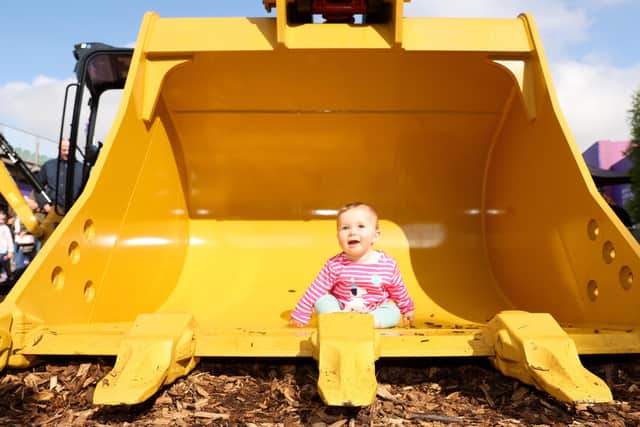11th April 2023 - Northern Ireland. Day three at Balmoral Show, in partnership with Ulster Bank.  Six-months-old Louisa Porter checks out the heavy machinery on offer. Picture by Jonathan Porter/PressEye