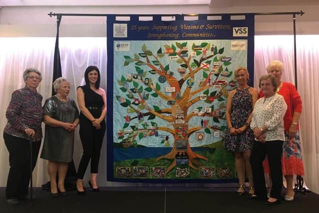Supporters and staff from of the South East Fermanagh Foundation (SEFF) display their 25th anniversary memorial quilt at SEFF's 25th anniversary dinner in the Royal Hotel in Cookstown recently.