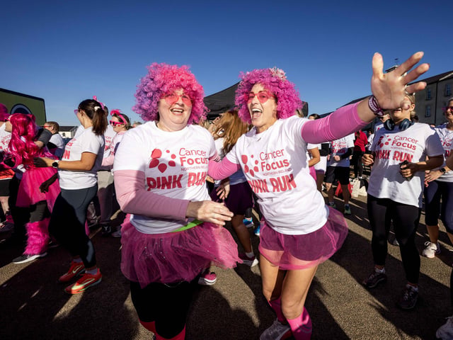 Runners, walkers, and pooches were splashed in pink powder from head to toe for a great cause as Cancer Focus NI’s first Pink Run took place in Londonderry. Picture Steven McAuley/McAuley Multimedia