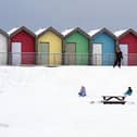 People ride sledges besides the beach huts at Blyth in Northumberland on Sunday, as temperatures dropped to around minus 11C in parts of the UK over the weekend. 
Photo: Owen Humphreys/PA Wire