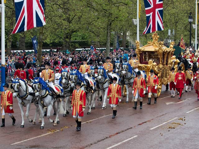 King Charles III and Queen Camilla are carried in the Gold State Coach in the coronation procession along The Mall to Buckingham Palace  on Saturday. The last coronation ceremony in 1953 introduced modern innovations like live TV coverage, and reflected the fact that the British Empire was shrinking. The royal family has adapted to change, and that is part of its success as an institution. Photo: Lucy North/PA Wire