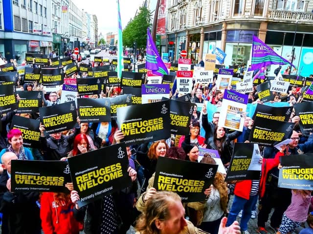 Image from Amnesty International of a rally at Belfast City Hall, welcoming refugees (asylum seekers are people who are applying for refugee status)
