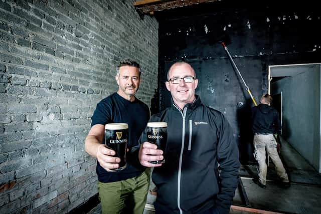 First ever 'Guinness only' bar comes to Belfast. Pictured are Mark Beirne, director Clover Group and Austin Guy, strategic account manager, Diageo at the new White’s Store