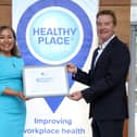 Hughes Insurance has become the first and only company in Northern Ireland to achieve the Healthy Place to Work certification for the third time. It highlights the organisation as a leading firm for workplace health, culture, and well-being. Pictured are Bernie McHugh Sonner, director of operations and customer services at Hughes Insurance and John Ryan, founder and CEO of Healthy Place to Work