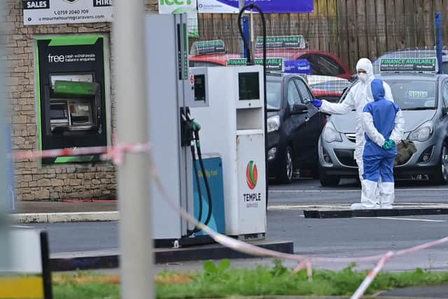 Police Forensics and ATO  at the scene of  a security alert in the Carryduff Road area of Temple outside Lisburn investigating a report that a suspicious object has been left in the area.

The Carryduff Road is closed near the roundabout area at Temple.
Pic Colm Lenaghan/Pacemaker