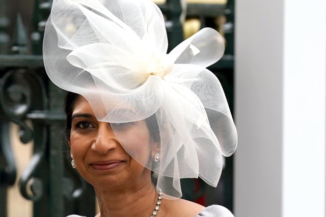 Home Secretary Suella Braverman wore an ivory oversized fascinator in the shape of a flower.