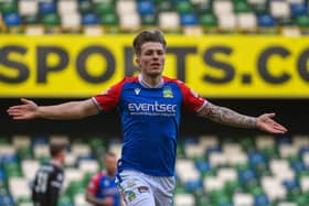 Chris McKee runs off in delight after netting the opener for Linfield against Ballymena United