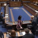 Alliance MLAs walk out of the chamber during a confidence debate in their farming minister Andrew Muir.