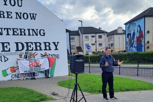 People Before Profit councillor Shaun Harkin at a BDS protest in Londonderry in July, soon after the UK government announced a clampdown on councils voting for BDS moves