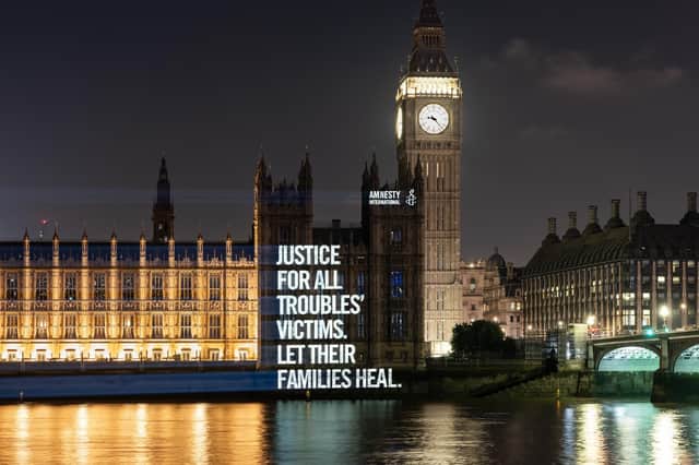 Images of victims of the Northern Ireland Troubles which were projected onto the Houses of Parliament in London. Amnesty International/PA Wire