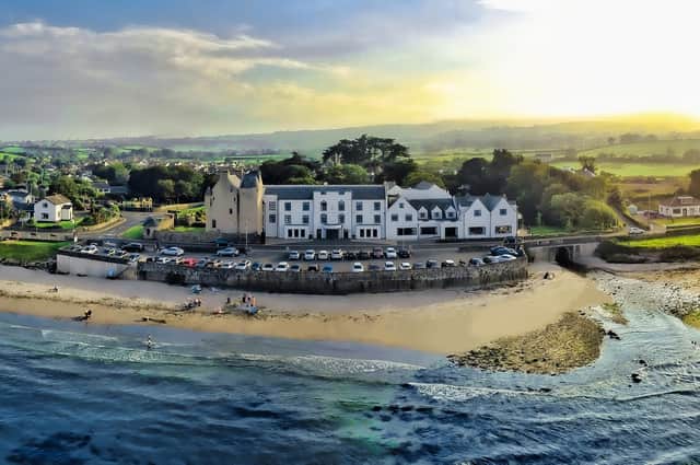Ballygally Castle Hotel in Ireland with the gorgeous beach at the front.