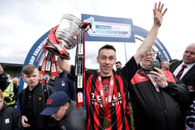 Paul Heatley celebrates with the Gibson cup after Crusaders' success in 2016. PIC: Presseye/Stephen Hamilton